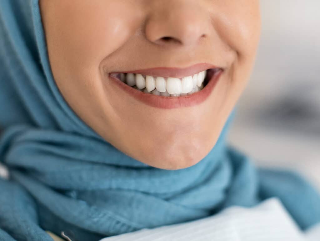 perfect smile concept closeup shot of islamic lad 2022 12 16 08 41 03 utc scaled e1698694528430