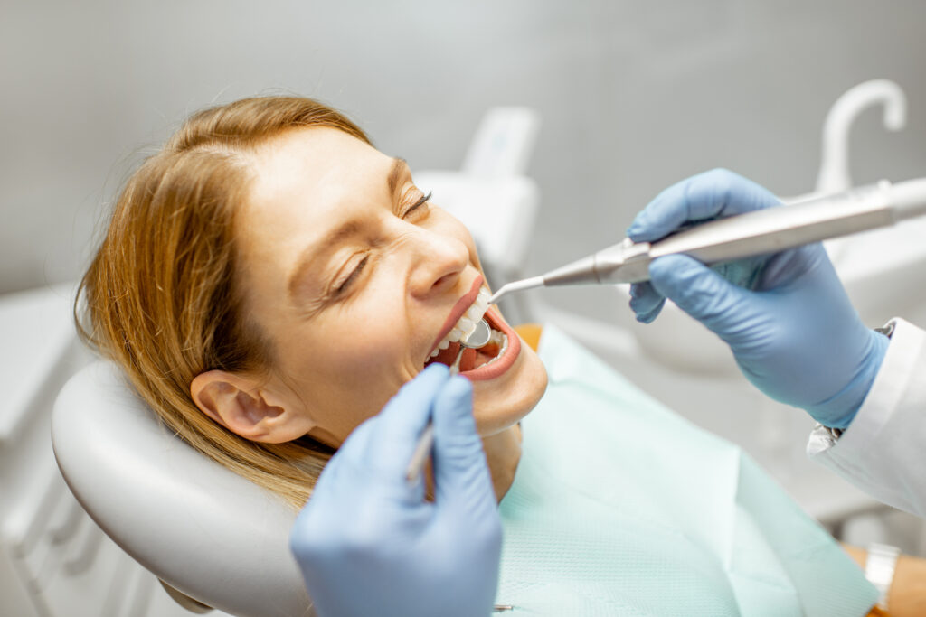 woman during a teeth inspection at the dental offi 2022 01 18 23 45 11 utc