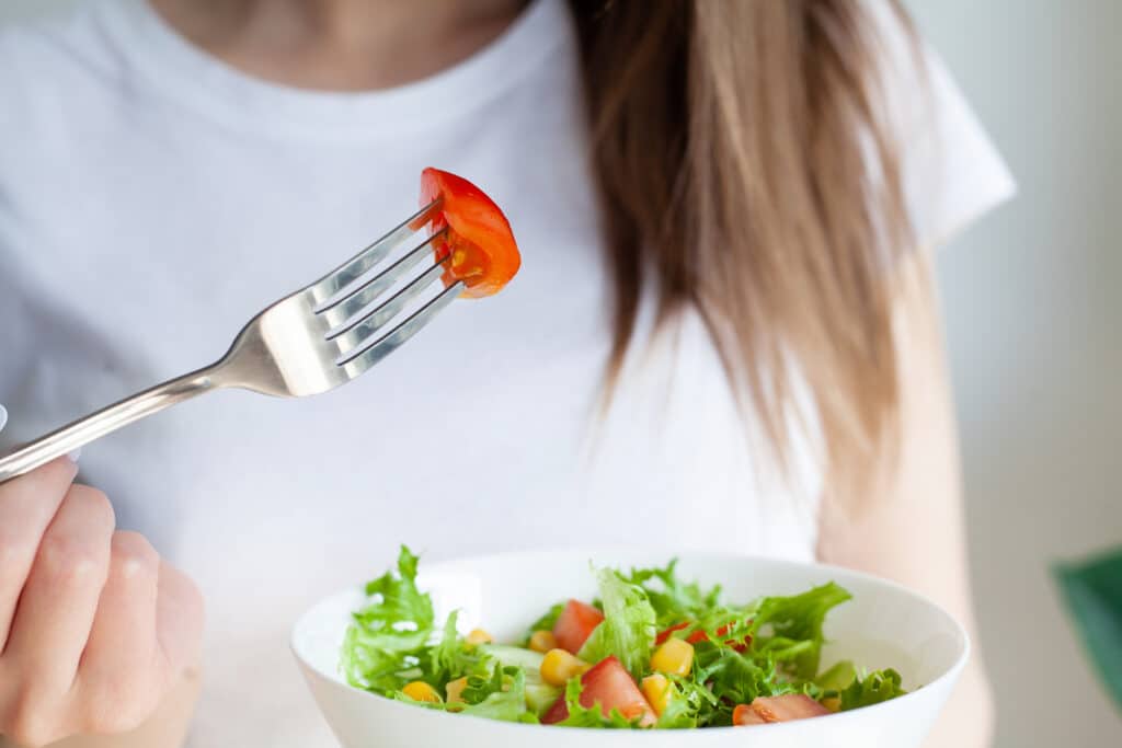young woman eating healthy food sitting in the lig 2023 06 21 07 24 38 utc